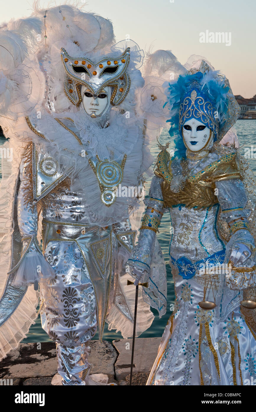 Two people in costume at the Venice Carnival Stock Photo - Alamy