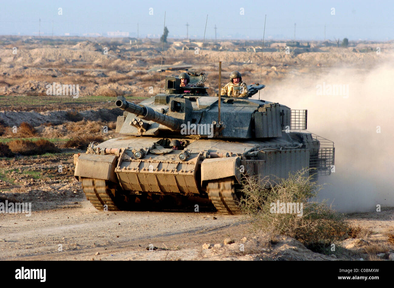 a british tanks heads back to baes after a day patrolling southen Iraq Stock Photo