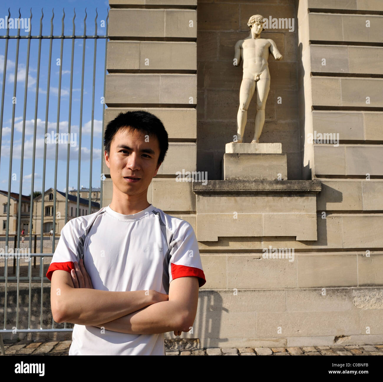 Paris, France, Portrait Young Chinese Man, Visiting Chateau de Vin-cennes, europe chinese tourist, asian man outside, Statue Stock Photo