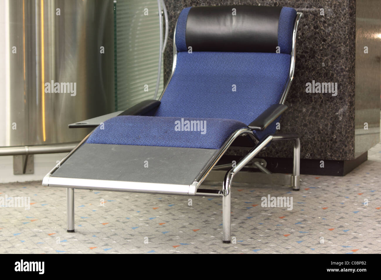 Airport reclined seating in Hong Kong International Airport Stock Photo