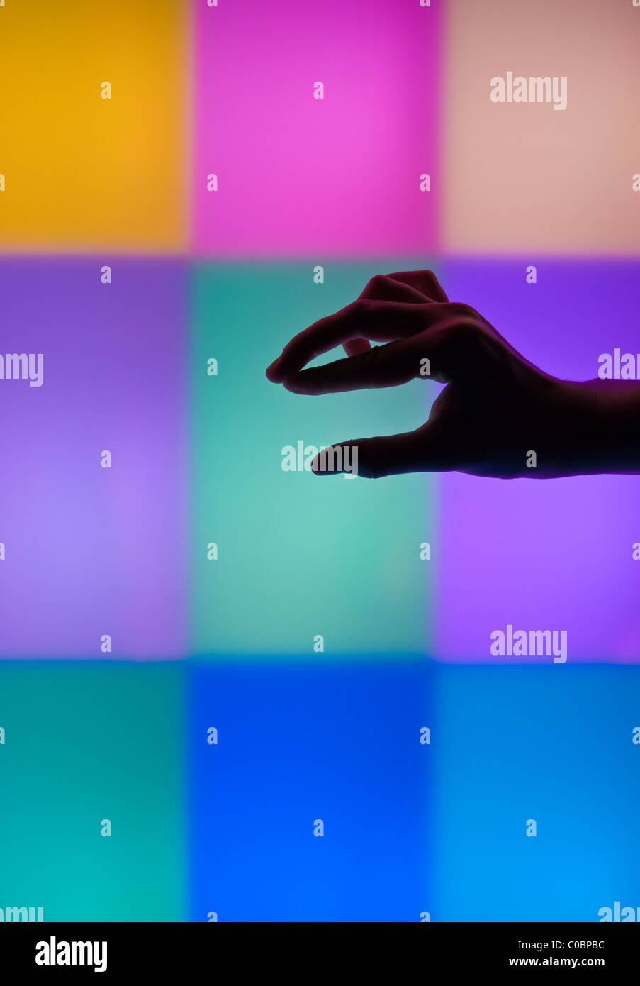 Hand silhouettes in the light sensory room. Stock Photo