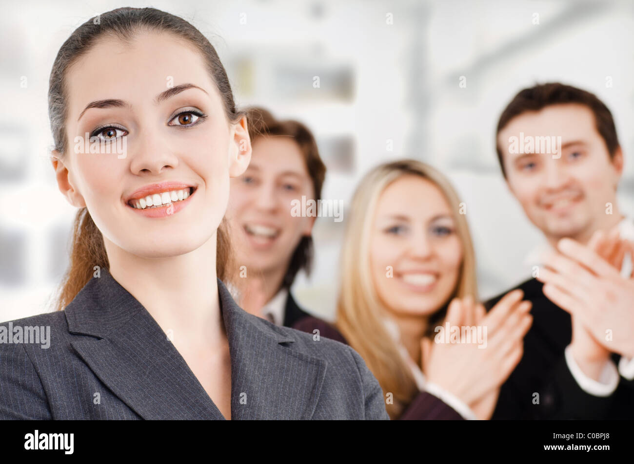 team of successful smiling young business people Stock Photo - Alamy