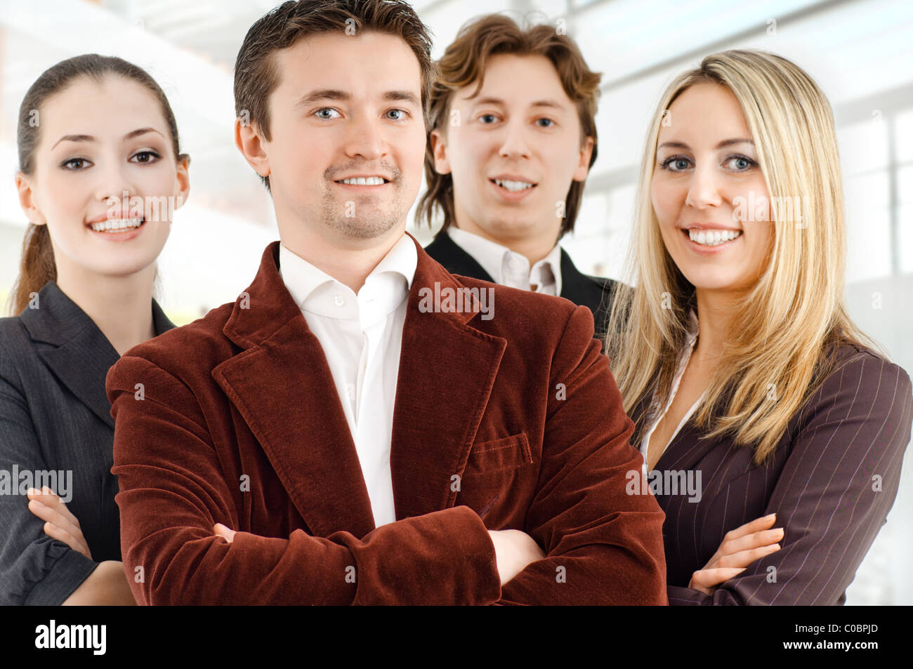 team of successful smiling young business people Stock Photo - Alamy