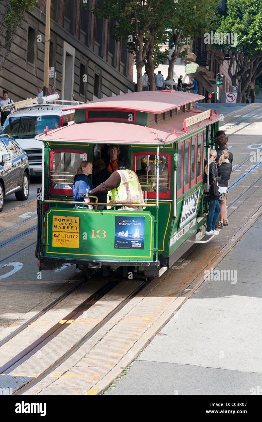 USA, California, San Francisco. Traditional cable car carrying passengers. Stock Photo