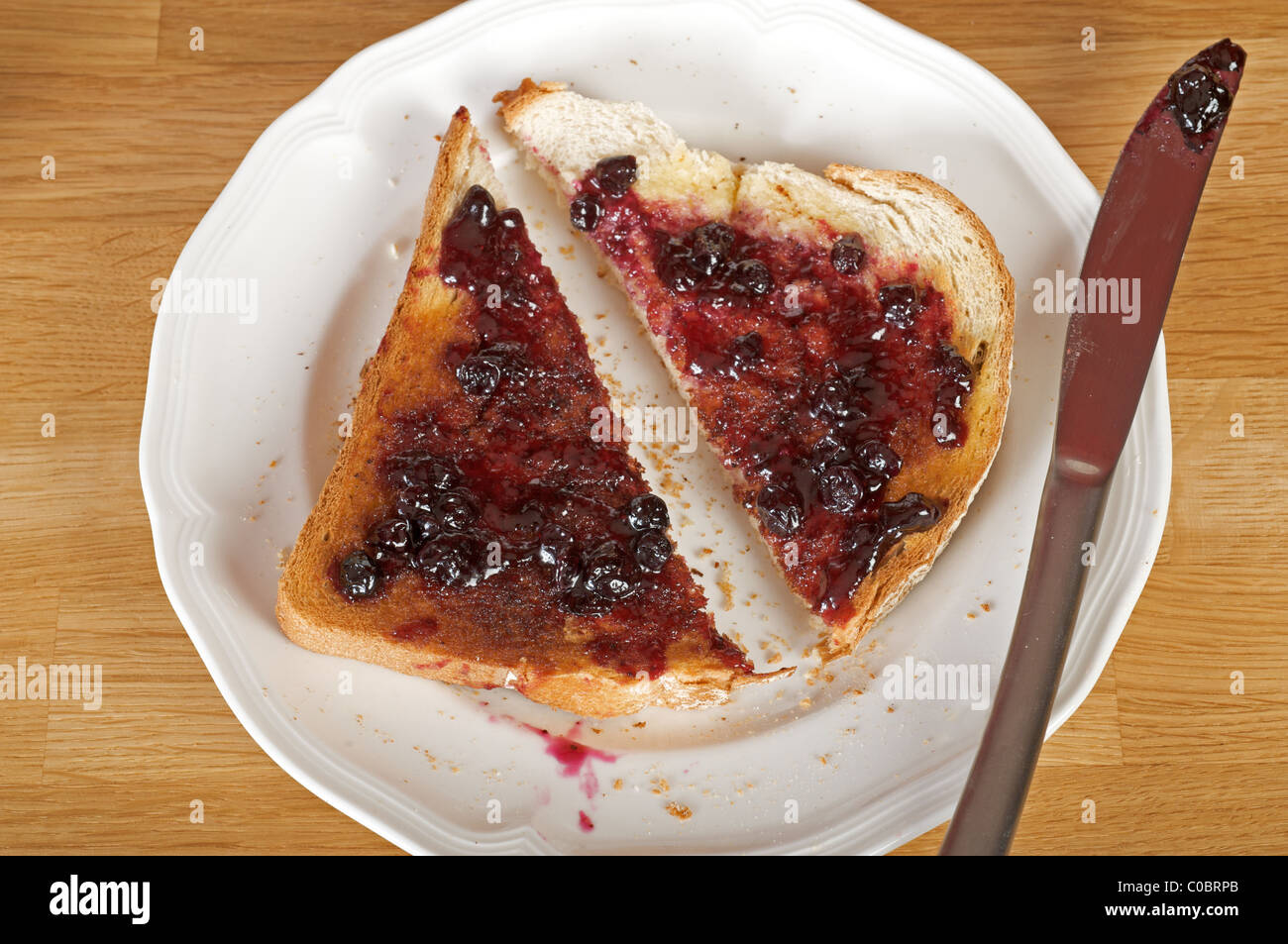 Blueberry jam on toast Stock Photo Alamy