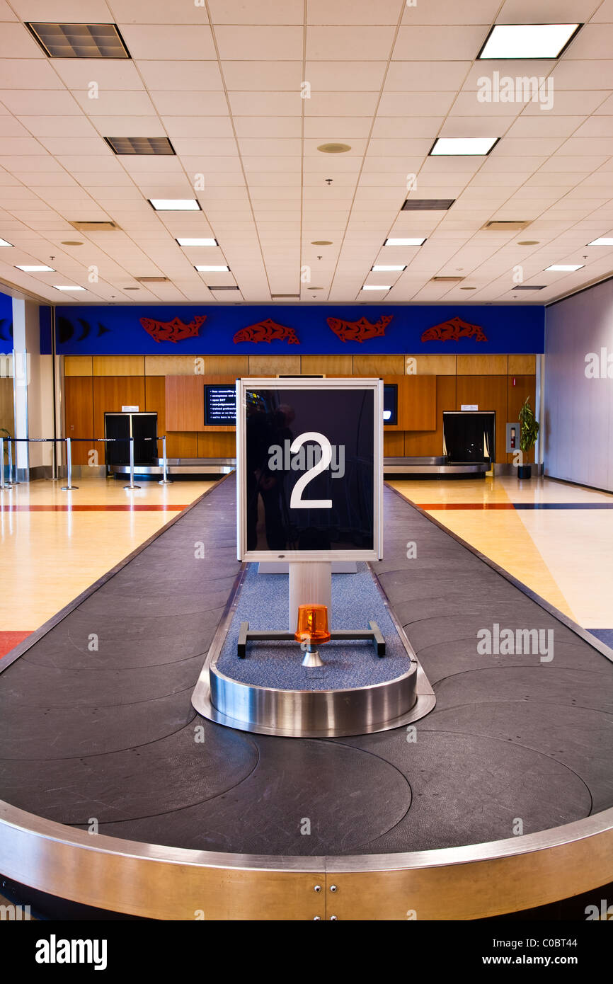 Baggage carousel in an airport arrivals area Stock Photo Alamy