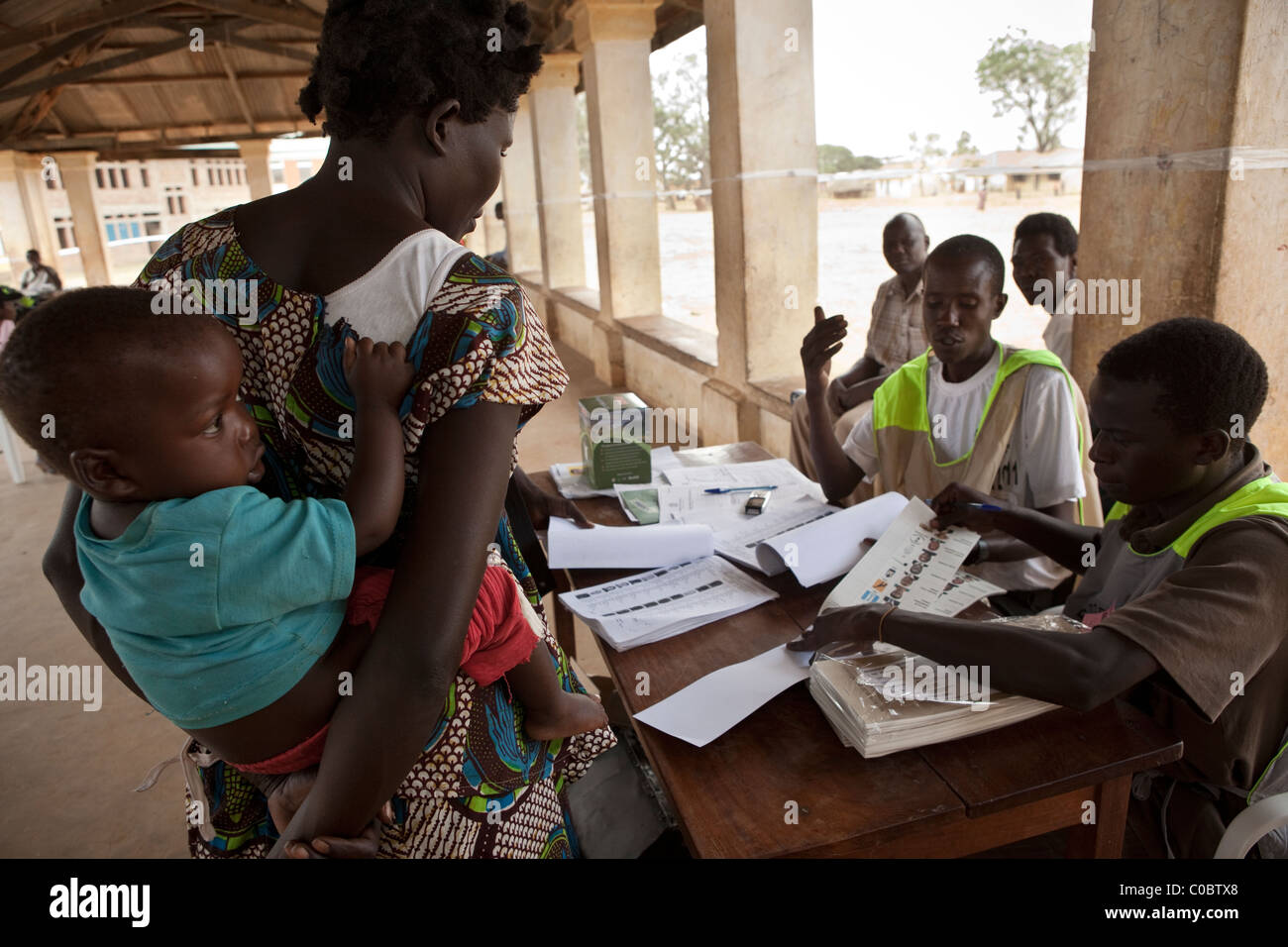 A young woman arrives at a polling station in Kumi, Uganda to cast her vote in the 2011 presidential election. Stock Photo