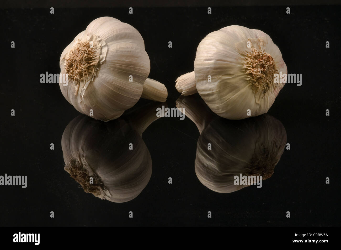Garlic bulbs on a black background Stock Photo