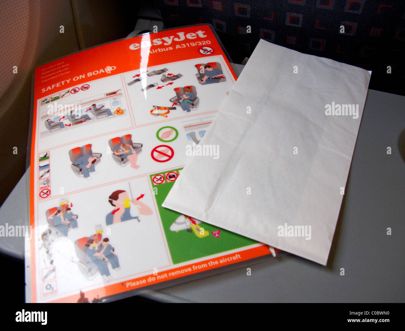 easyjet a319 airbus aircraft safety on board card and sick bag Stock Photo