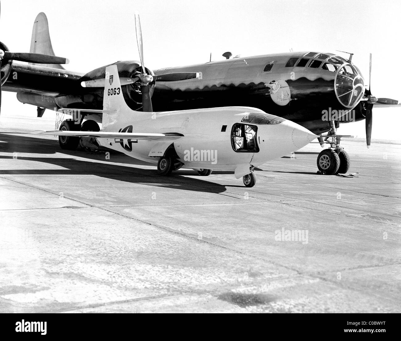 Bell Aircraft Corporation X-1-2 sitting on the ramp at NACA High- Speed Flight Research Station with Boeing B-29 launch plane Stock Photo