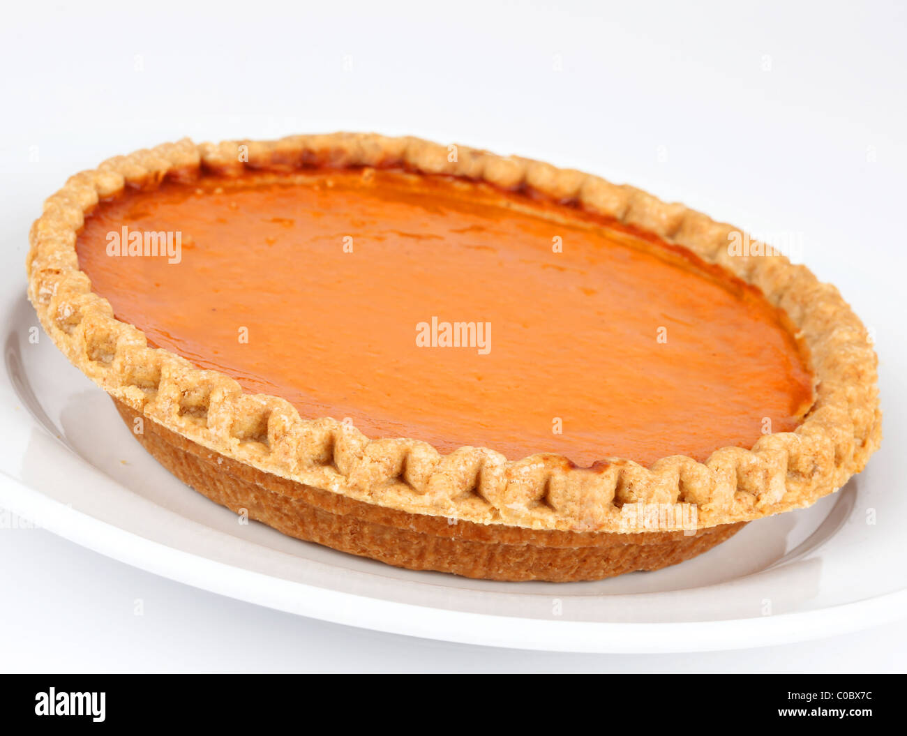 Pumpkin and sweet potato pie on white background Stock Photo