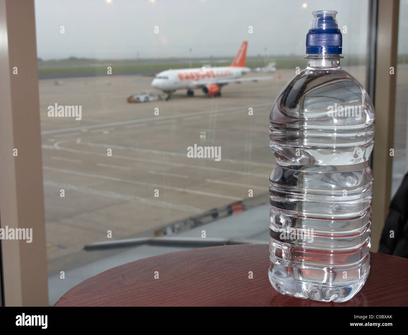 litre bottle of water on a table at liverpool john lennon airport merseyside uk Stock Photo