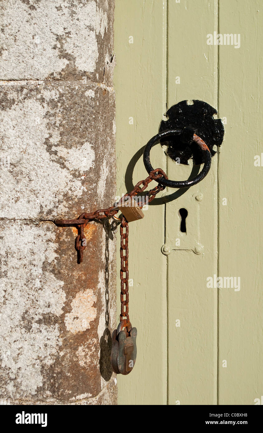 a church door chained and locked, cornwall, uk Stock Photo