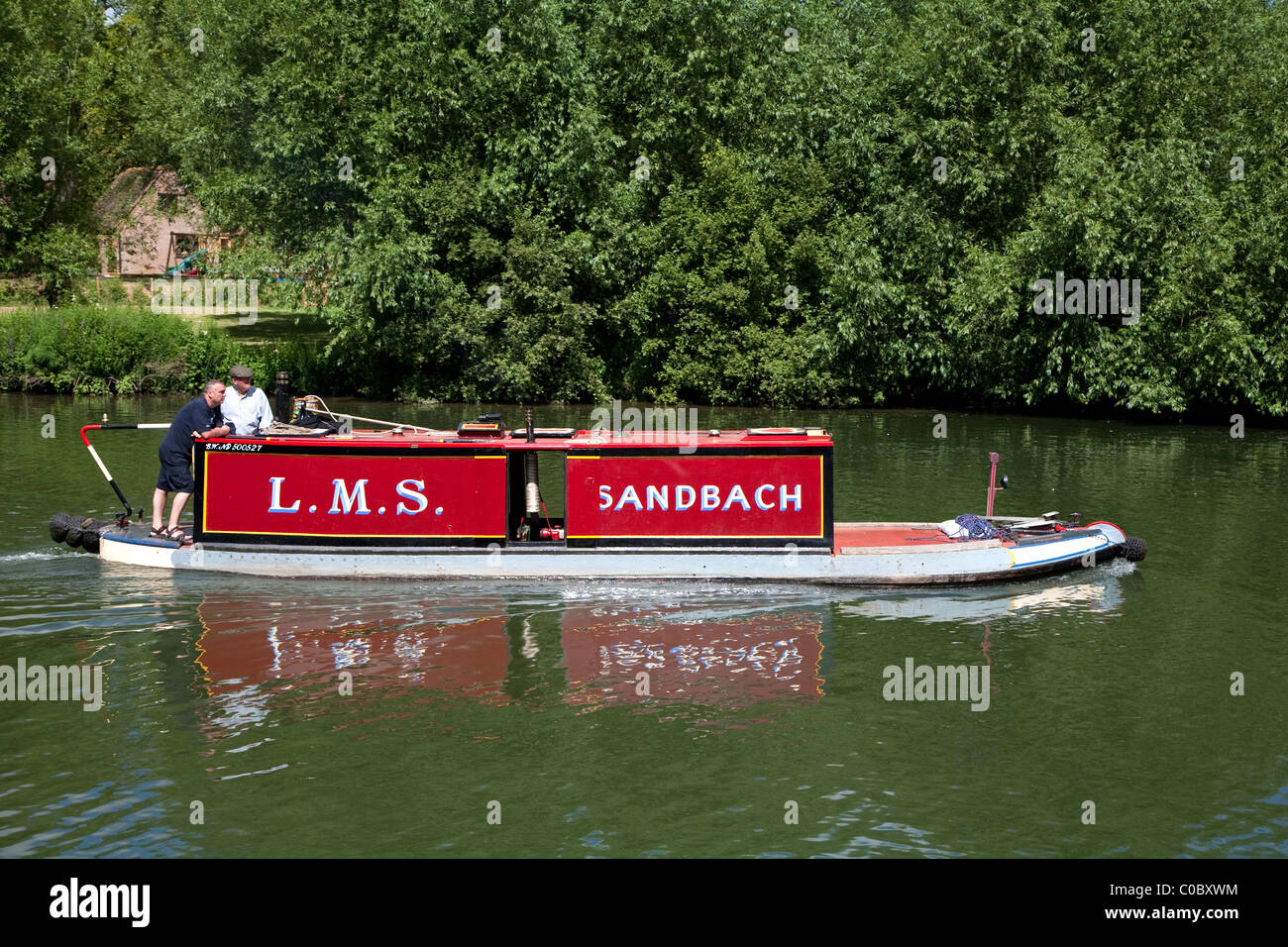 Small canal boat on Thames at Goring and Streatley Stock Photo