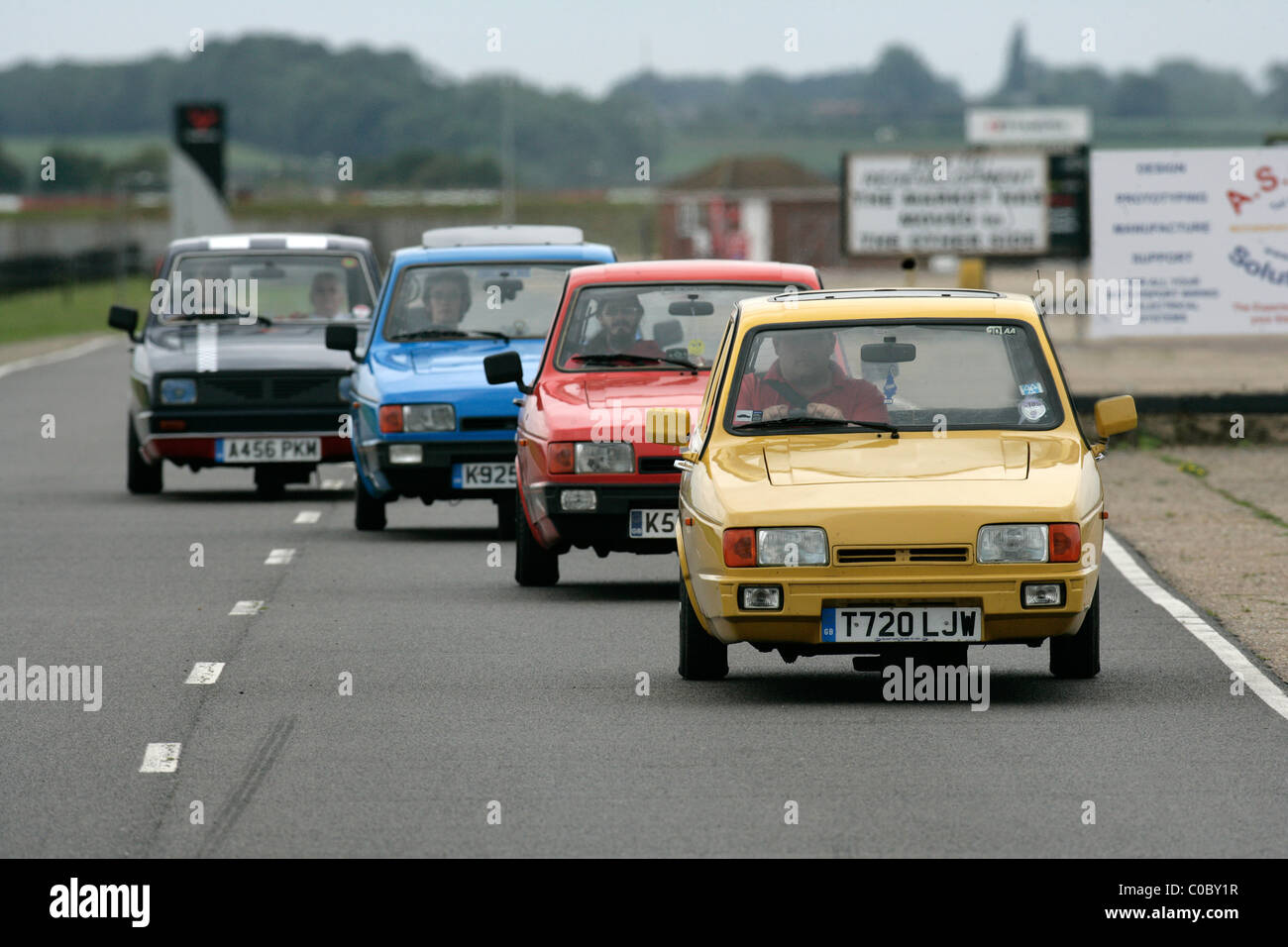 Four Reliant Robins driving in line Stock Photo - Alamy