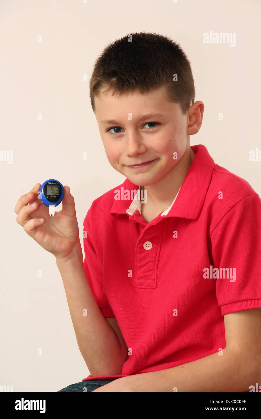Diabetic Child Showing Result Of Blood Glucose Test Stock Photo Alamy