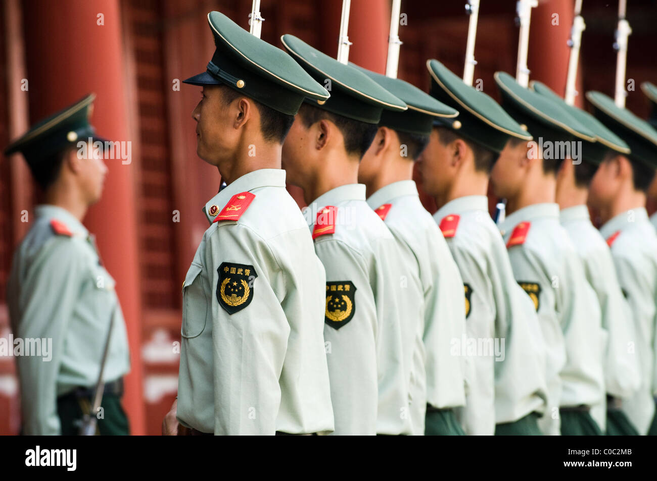 Chinese soldiers standing in line and listening to their commands from their officer. Stock Photo
