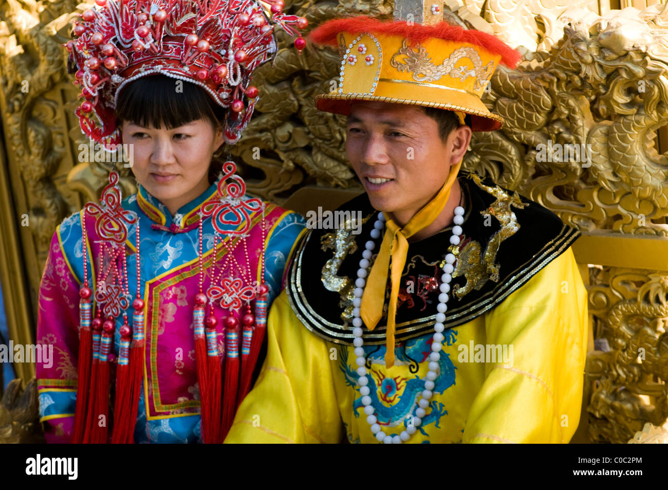 A Chinese couple dressed as the emperors of China Stock Photo - Alamy