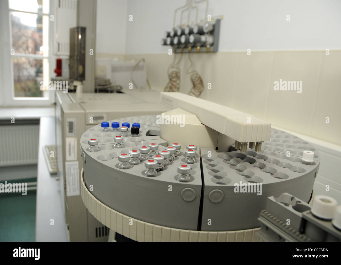 Sample vials on Gas Chromatograph autosampler in The Central Forensic Laboratory of the Polish Police in Warsaw Stock Photo