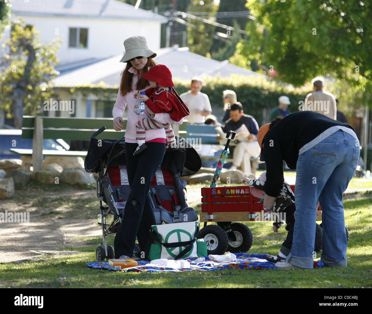 Marcia Cross visiting a park with her twin daughters, Eden and Savannah