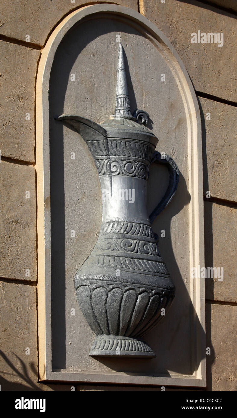 A bas-relief representation of an Arabian coffee pot, known as a Dallah. Stock Photo