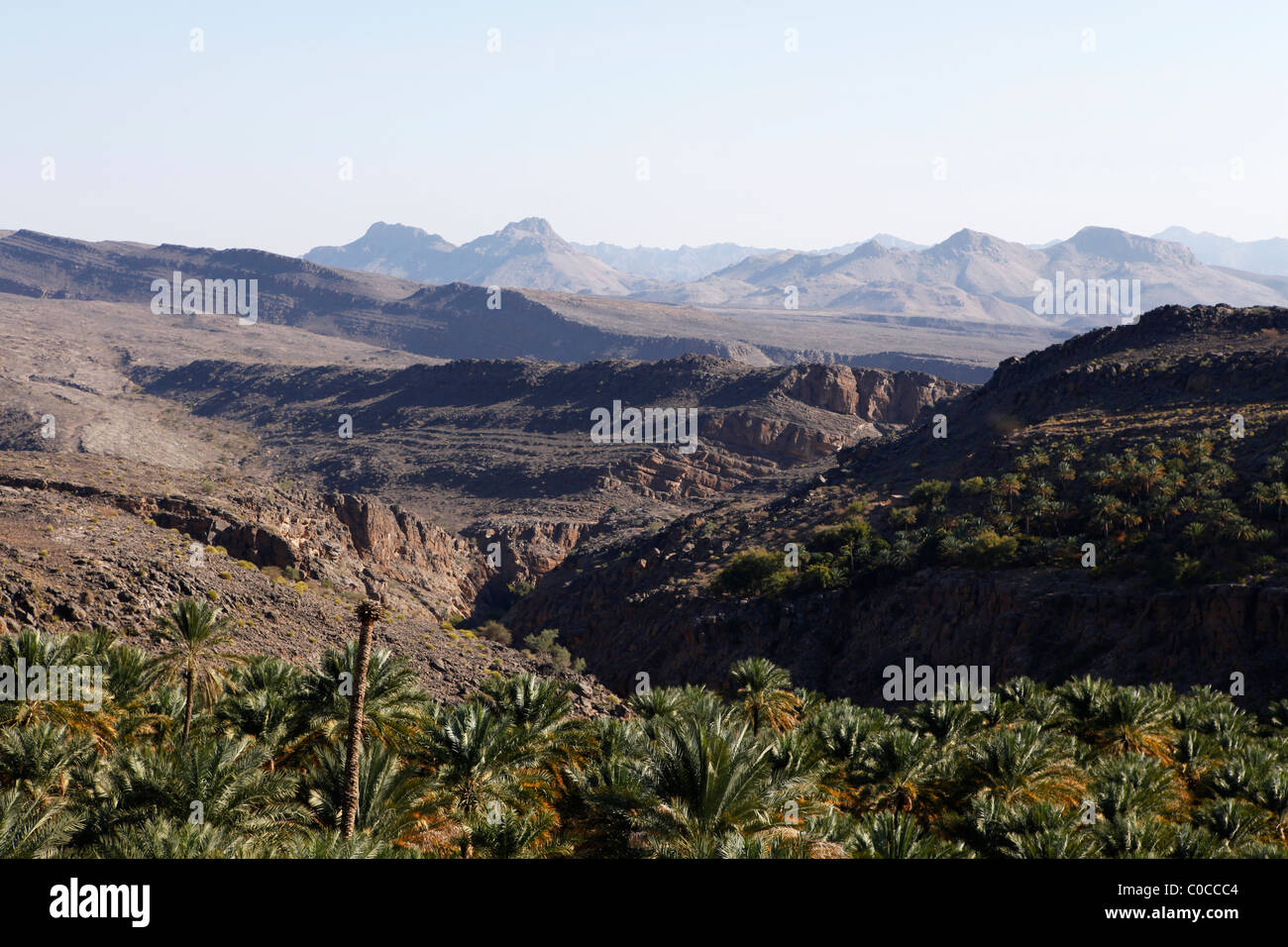 The arid interior of Oman, seen from the mountain village of Misfah. Stock Photo