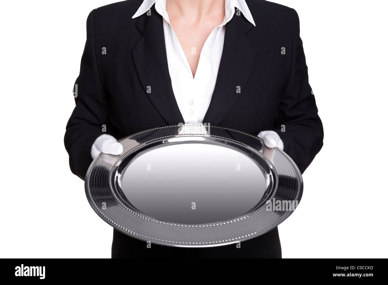 Photo of a female butler holding a silver tray, isolated against a white background. Good image for product placement. Stock Photo