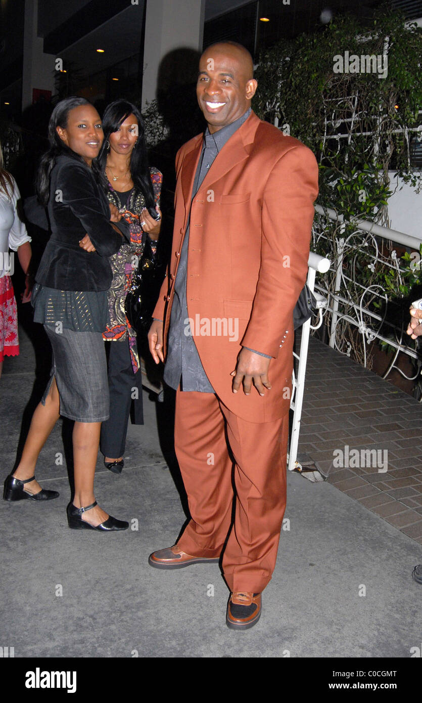 Former NFL player Deion Sanders leaving a restaurant after dining with