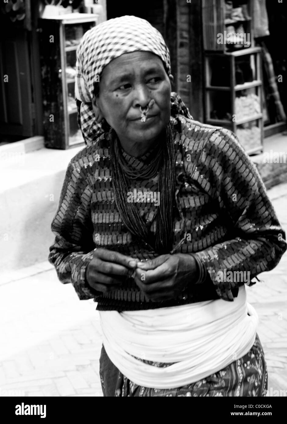 old nepalese lady with face jewellery ,peoples lives ( the nepalis ) , life in kathmandu , kathmandu street life , nepal Stock Photo