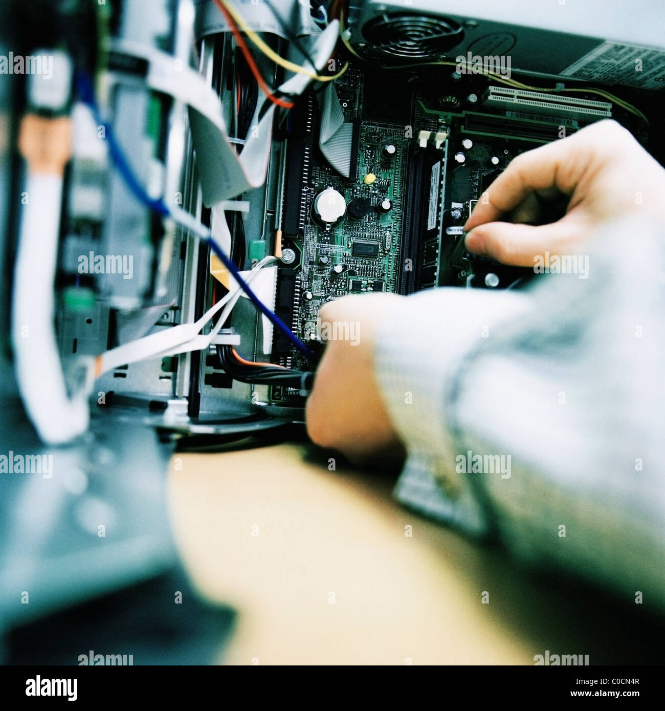 Man servicing computer mainframe Stock Photo