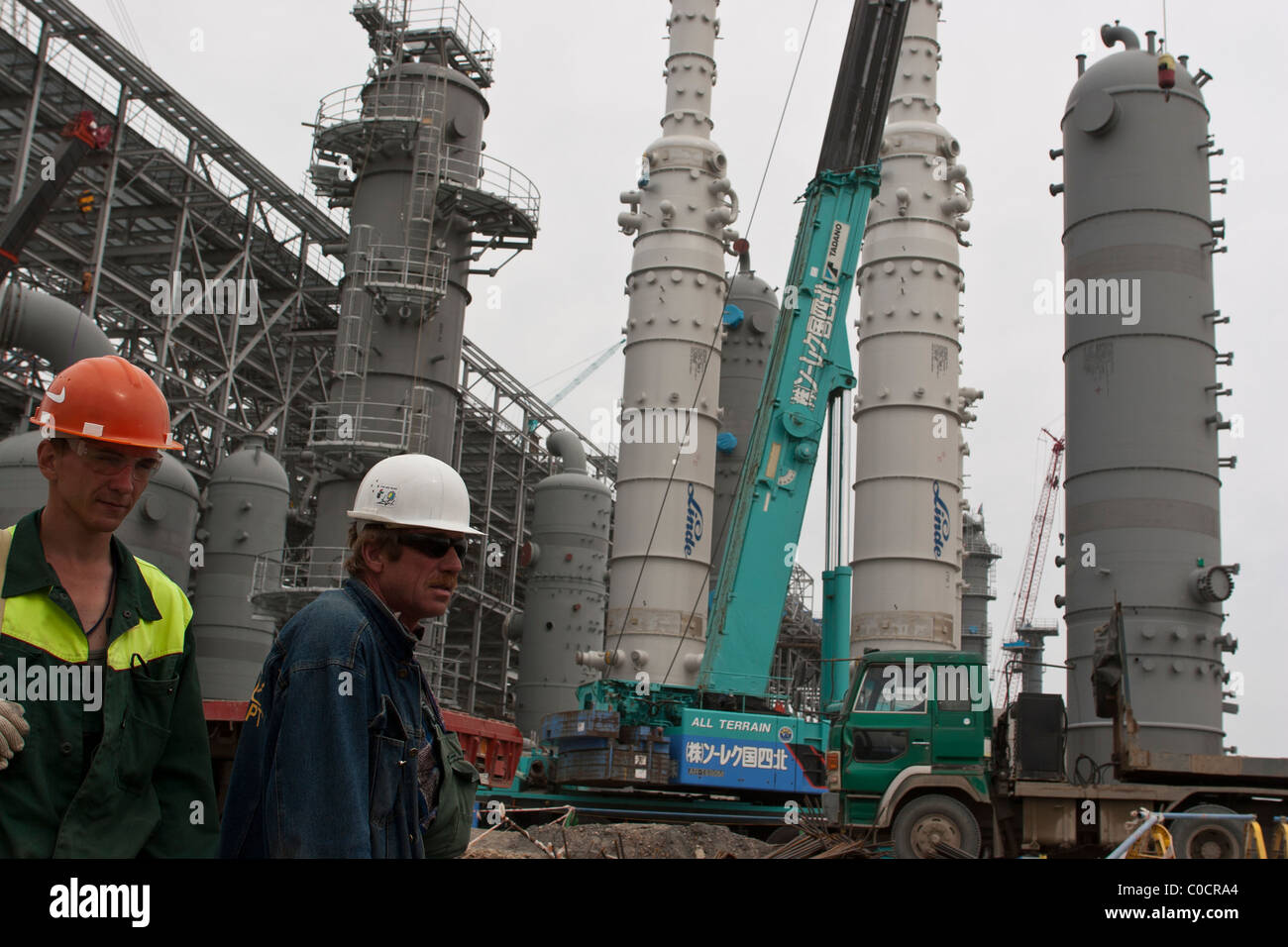 Workmen at work near the crucial Main Cryogenic Heat Exchanges at the