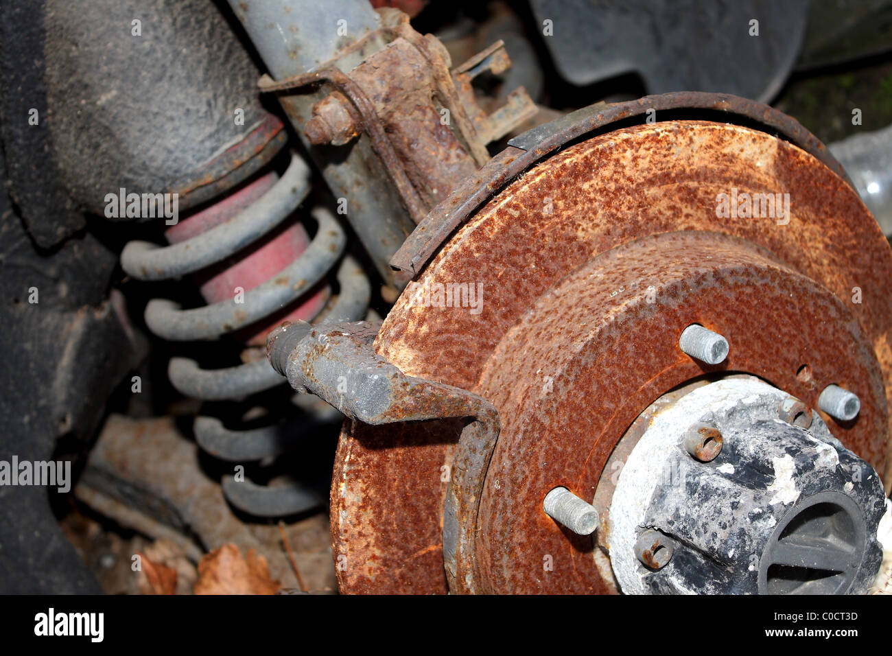 An old rusted wheel hub with the wheel and tyre missing and possibly