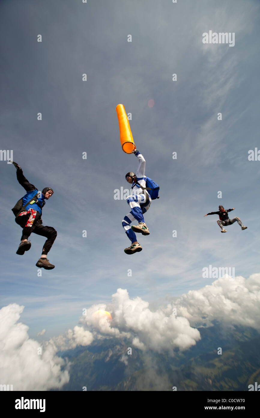 Freefly skydiving team is training a formation sit flying around an air ...