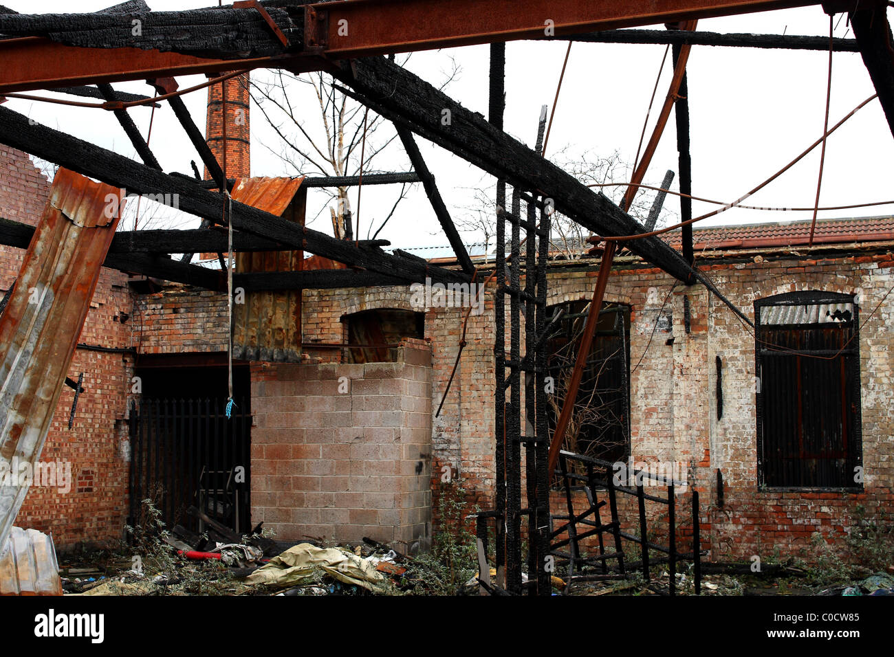 A fire damaged building, possibly burnt down by arson and vandalism. Stock Photo