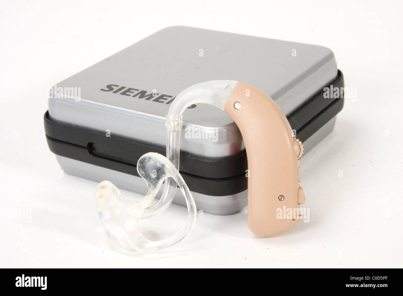 A digital hearing aid by Siemens for a NHS hearing aid fitting. Including an ear mold and box. Stock Photo