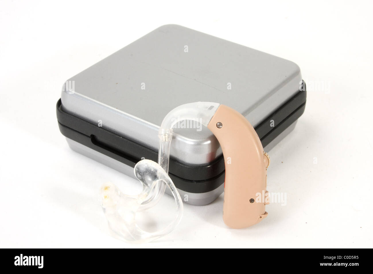 A digital hearing aid by Siemens for a NHS hearing aid fitting. Including an ear mold and box. Stock Photo