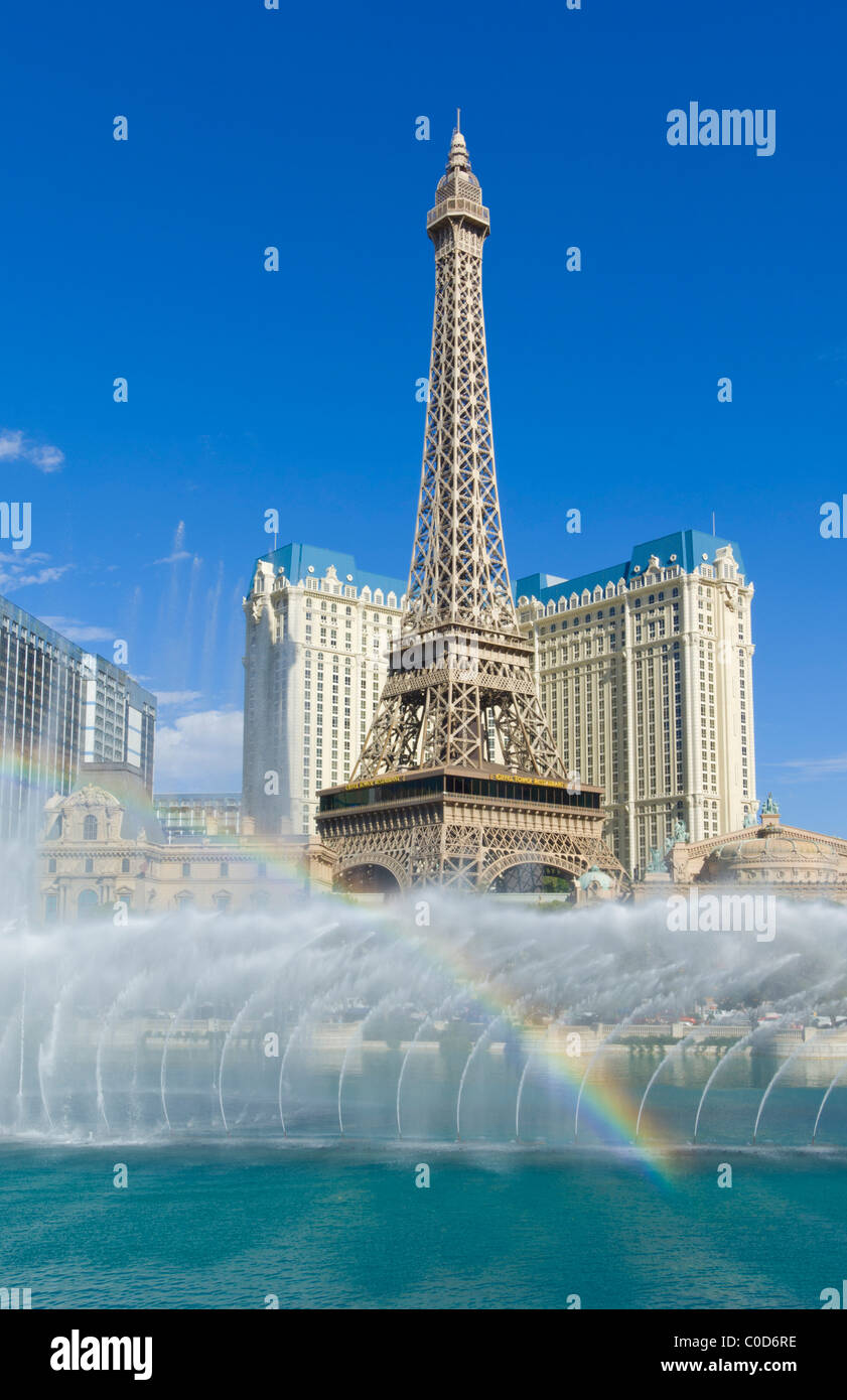 Water fountains and rainbow outside the Bellagio hotel with Paris hotel behind The Strip, Las Vegas Boulevard South, Las Vegas Stock Photo