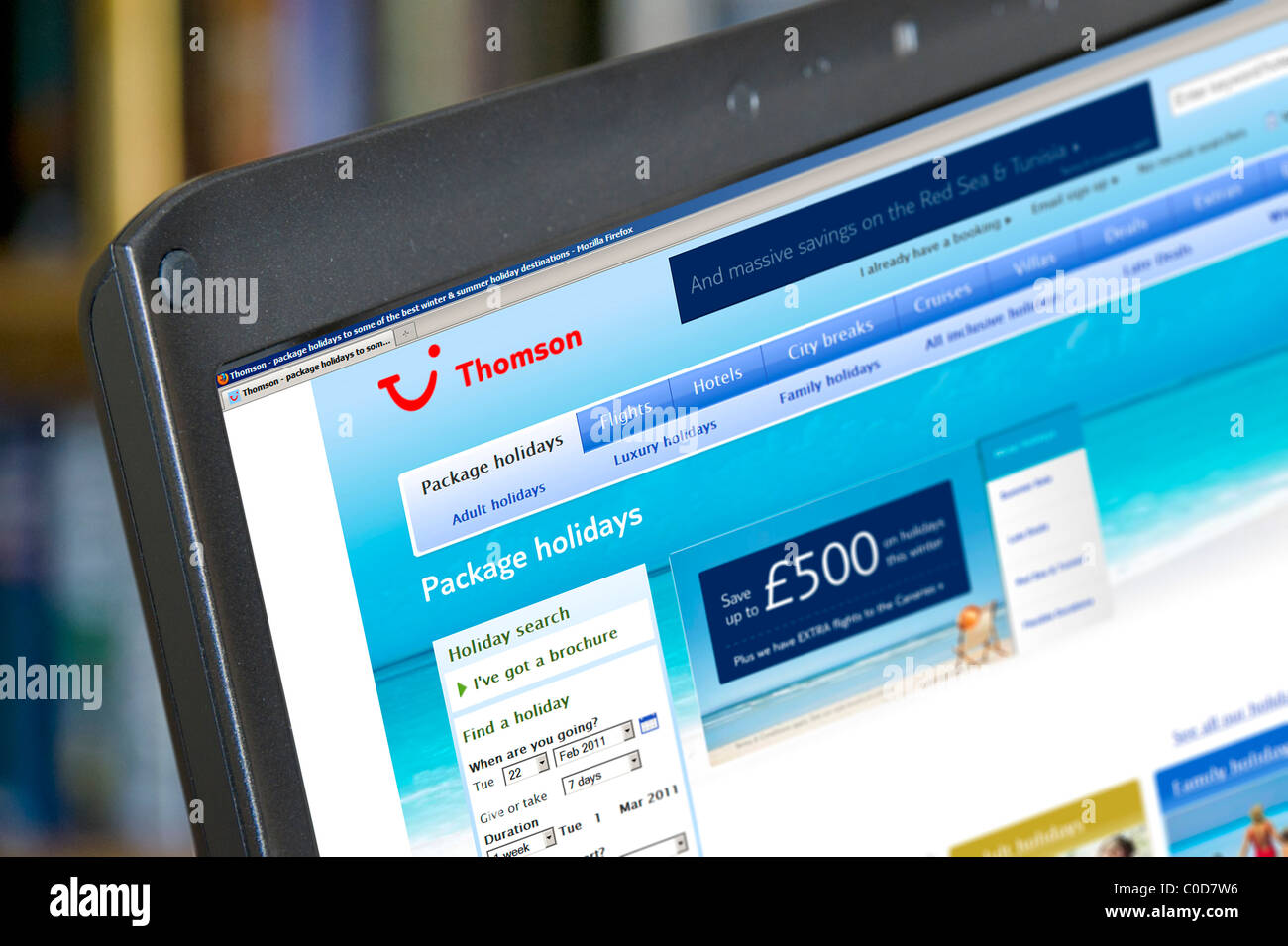 Browsing the Thomson Holidays website, UK Stock Photo