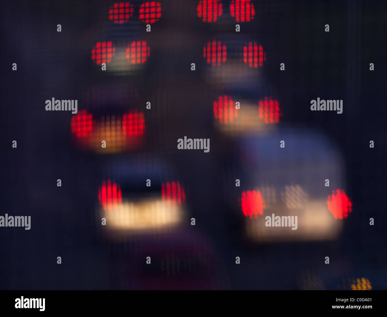 Brake lights of queing traffic photographed through protective metal grill  Stock Photo - Alamy