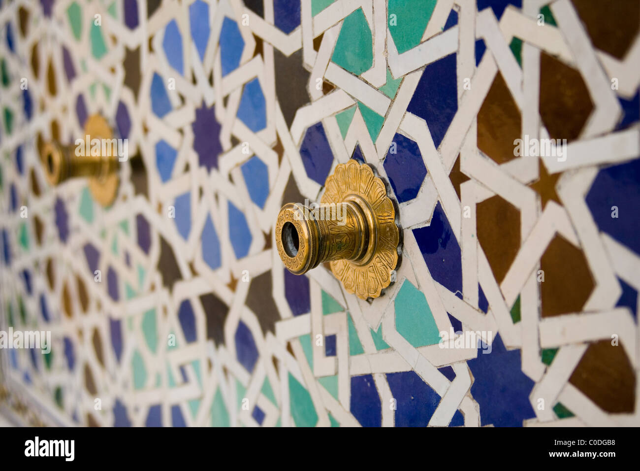 Typical moroccan tiled fountain in the city of Rabat, near the Hassan II Tower. Stock Photo