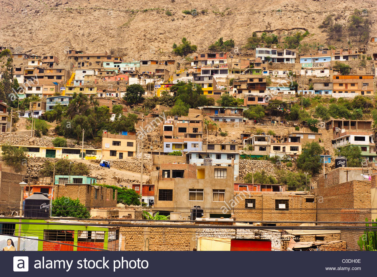 Small houses crowd a steep hillside in Chosica, Peru Stock Photo