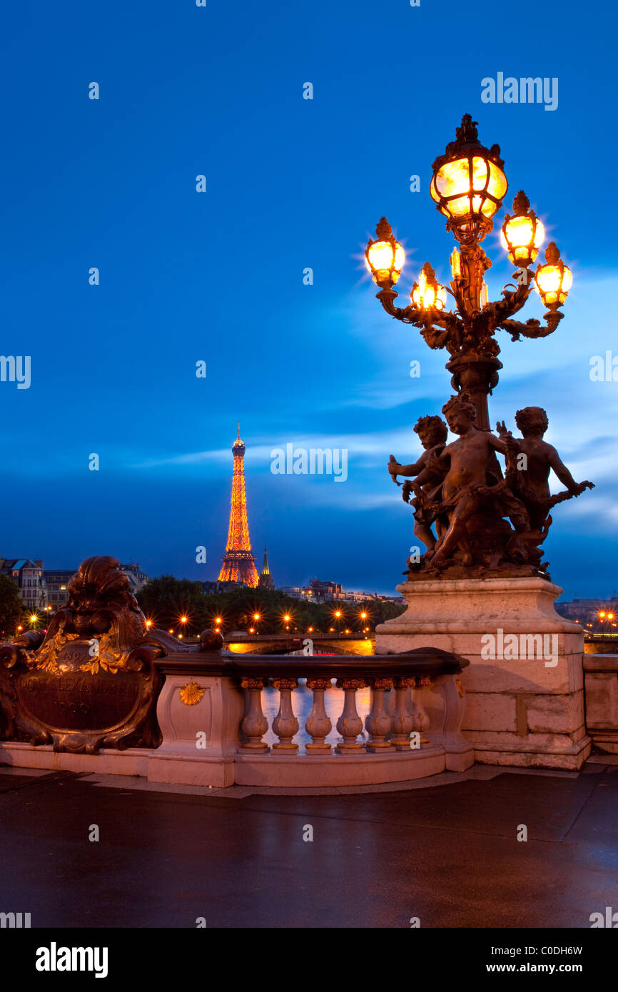 Lamppost on Pont Alexandre III over River Seine with the Eiffel Tower beyond, Paris France Stock Photo