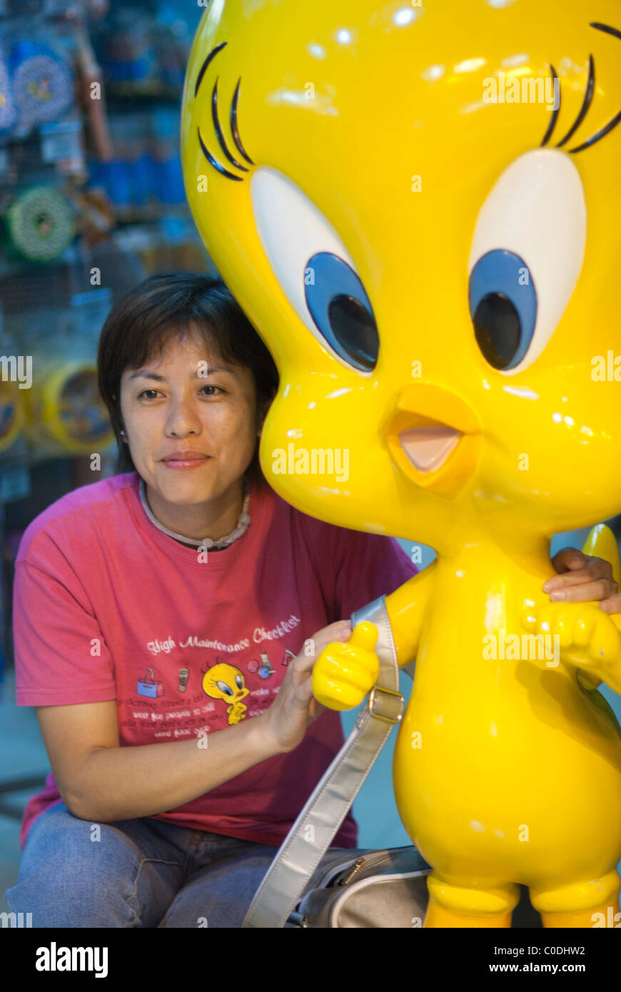 Grown up woman posing with l Tweety from loony tunes Stock Photo