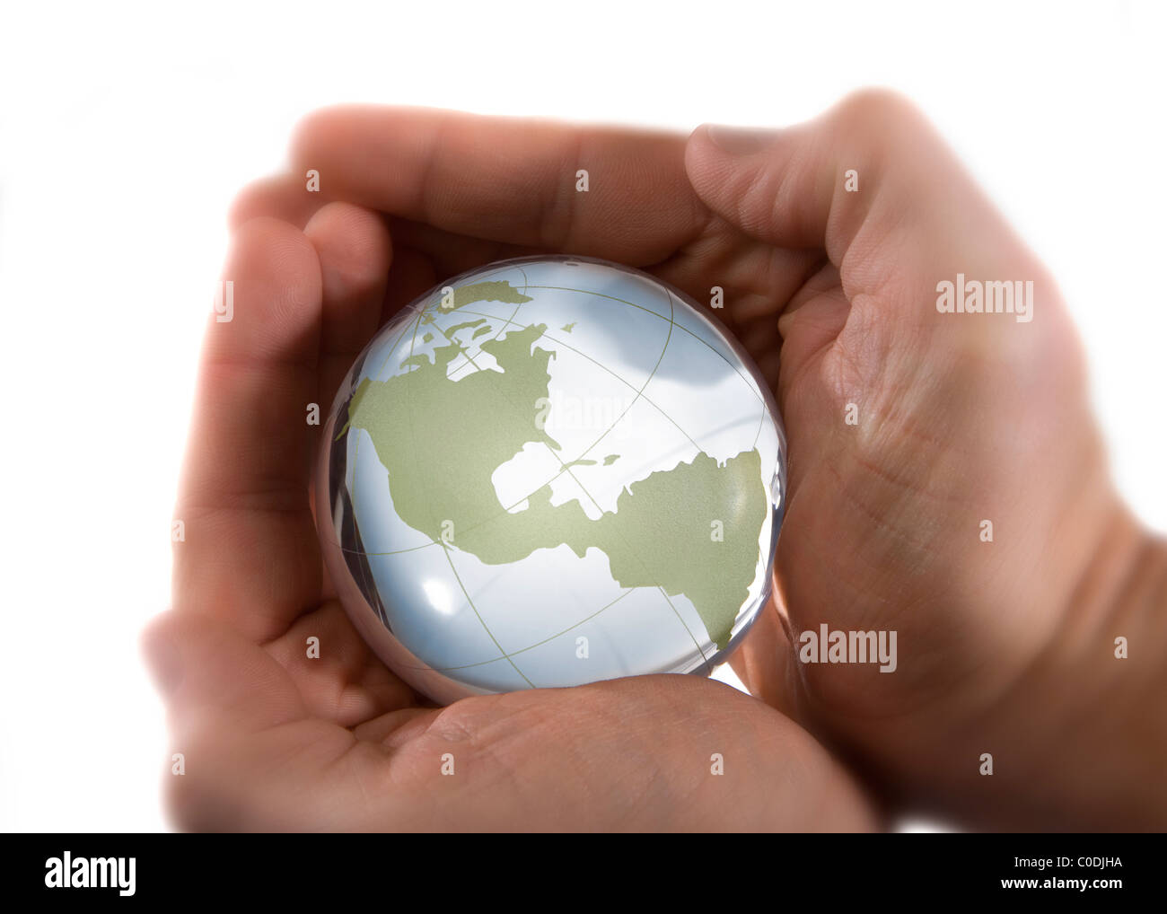 Glass Globe held in cupped hands Stock Photo