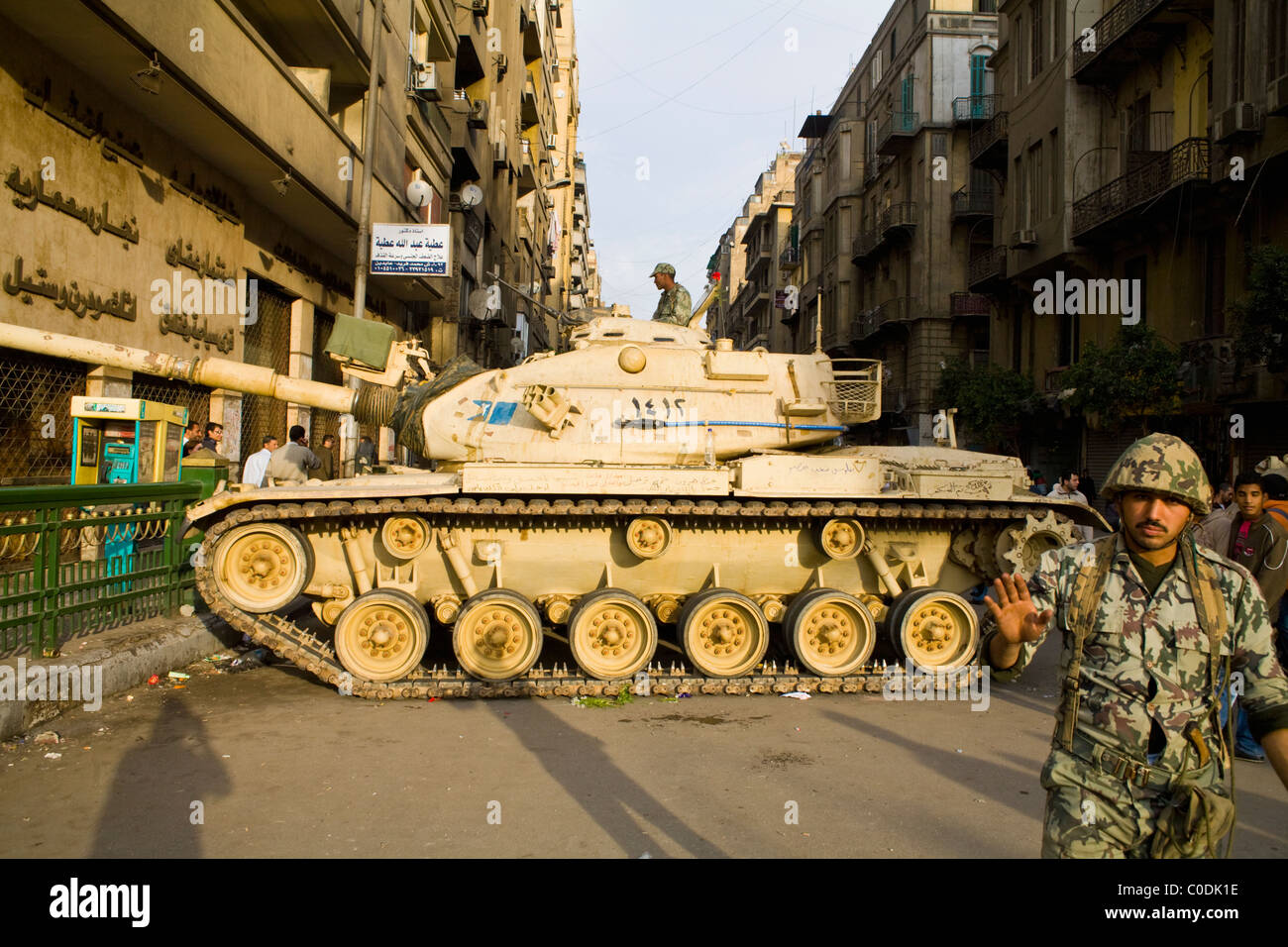 During the anti-government protests, an army tank blocks a street leading into Tahrir Square in downtown Cairo on Jan. 30, 2011 Stock Photo