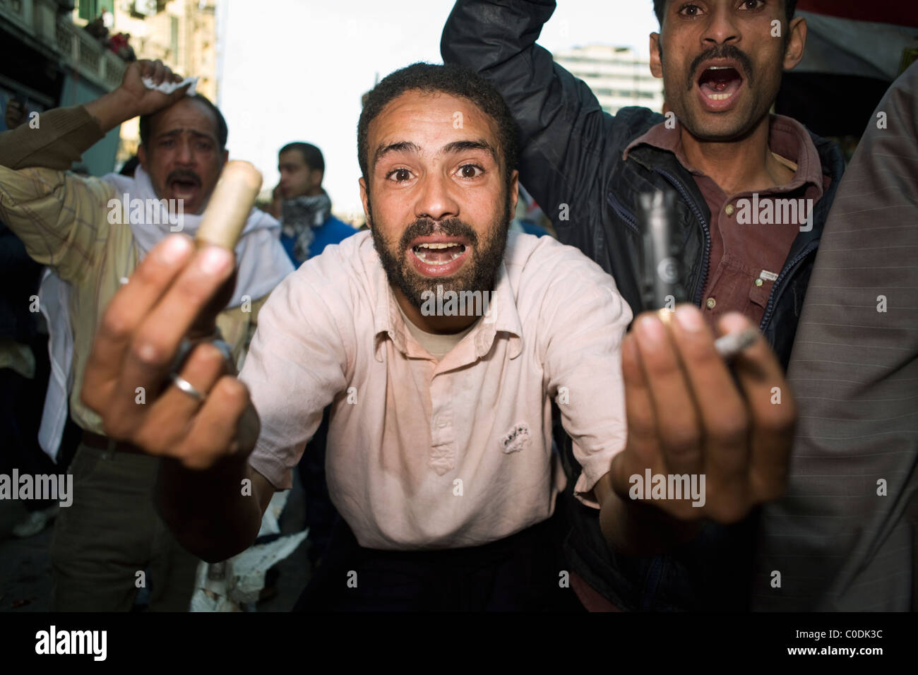 An anti-government protester holds up expended ammunition used by riot police in downtown Cairo, Egypt on Jan.28, 2011 Stock Photo