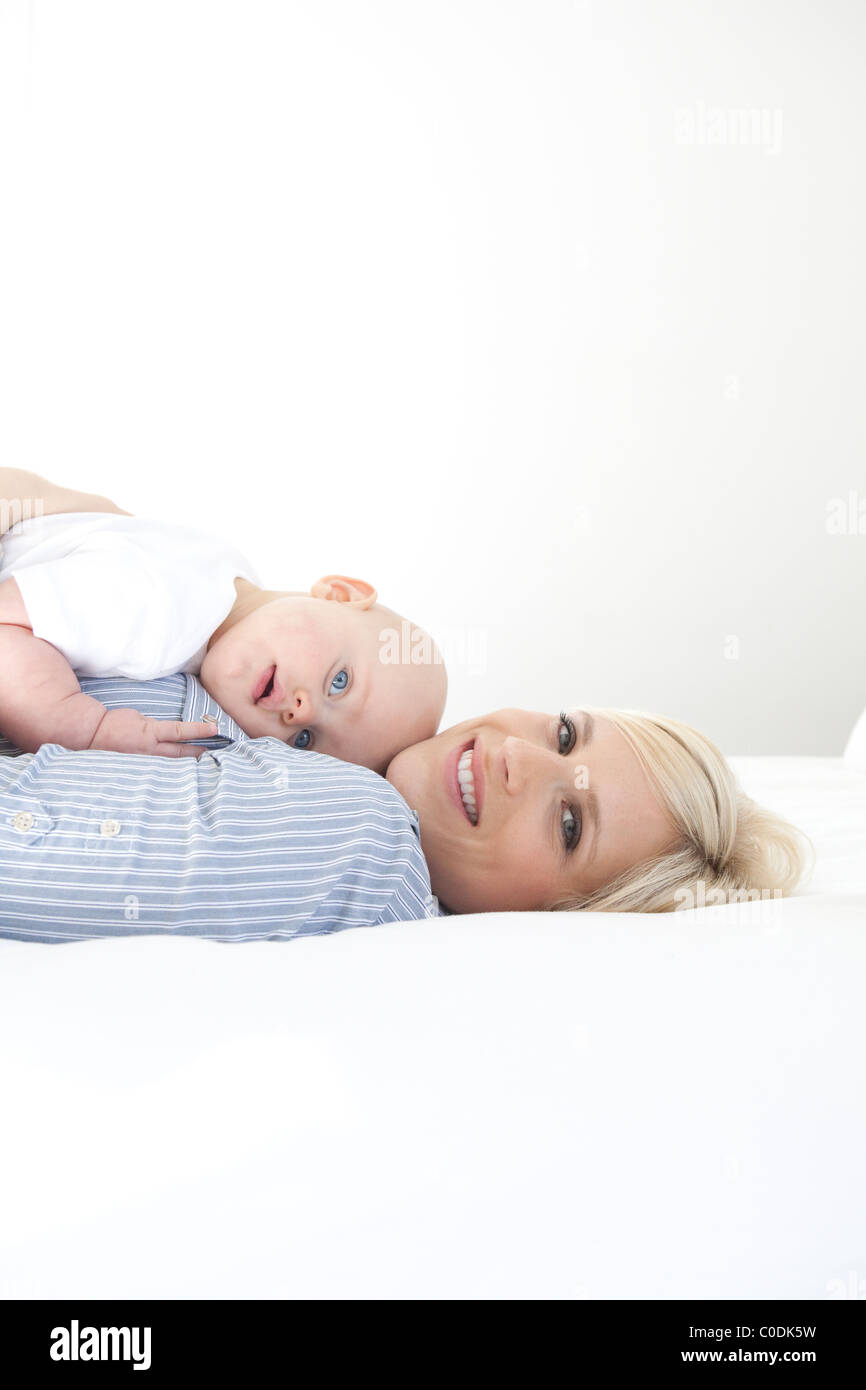 Baby laying on mom's chest Stock Photo Alamy