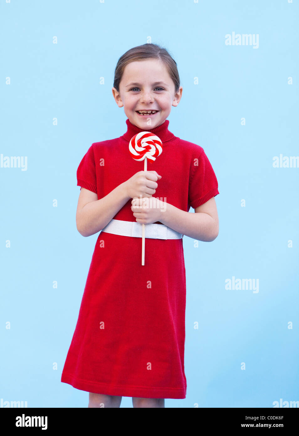 Little girl with peppermint lollipop Stock Photo