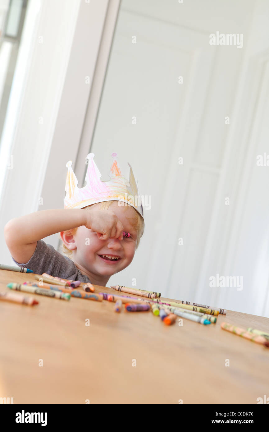 Little girl wearing home made crown Stock Photo