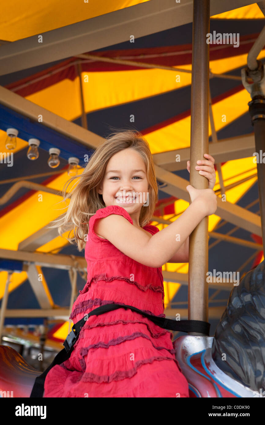 Little girl on carousel Stock Photo